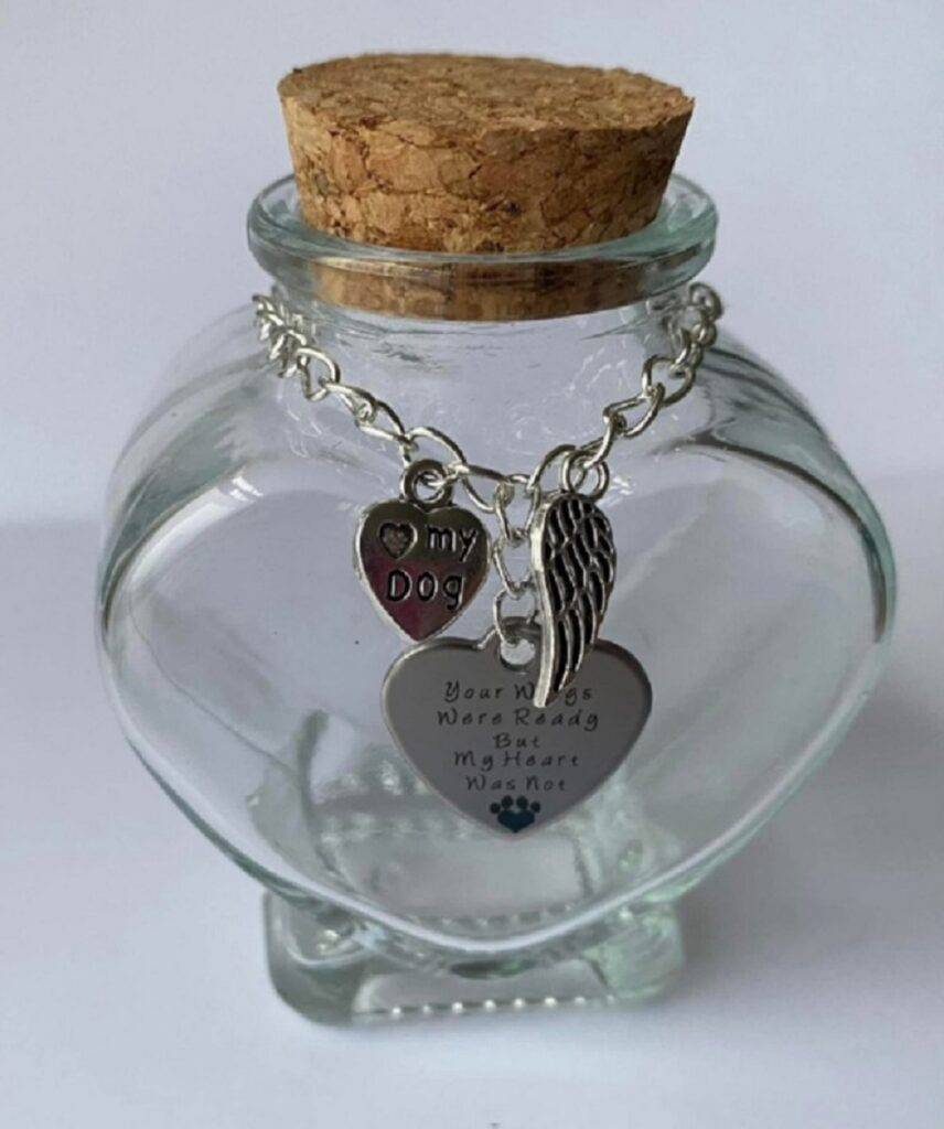 Image of a pet memorial heart shaped glass urn for token ashes